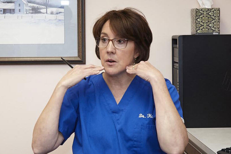 Dr. Anne Hartnett discussing dental procedure